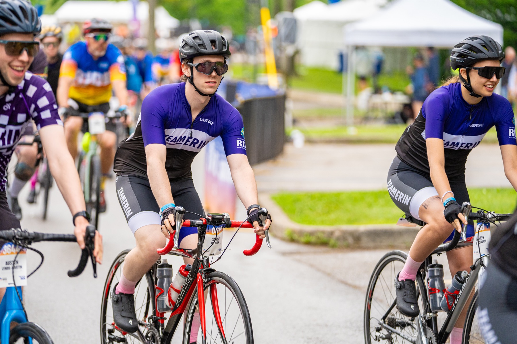 Team Erin riders cycling together in purple at the Ride