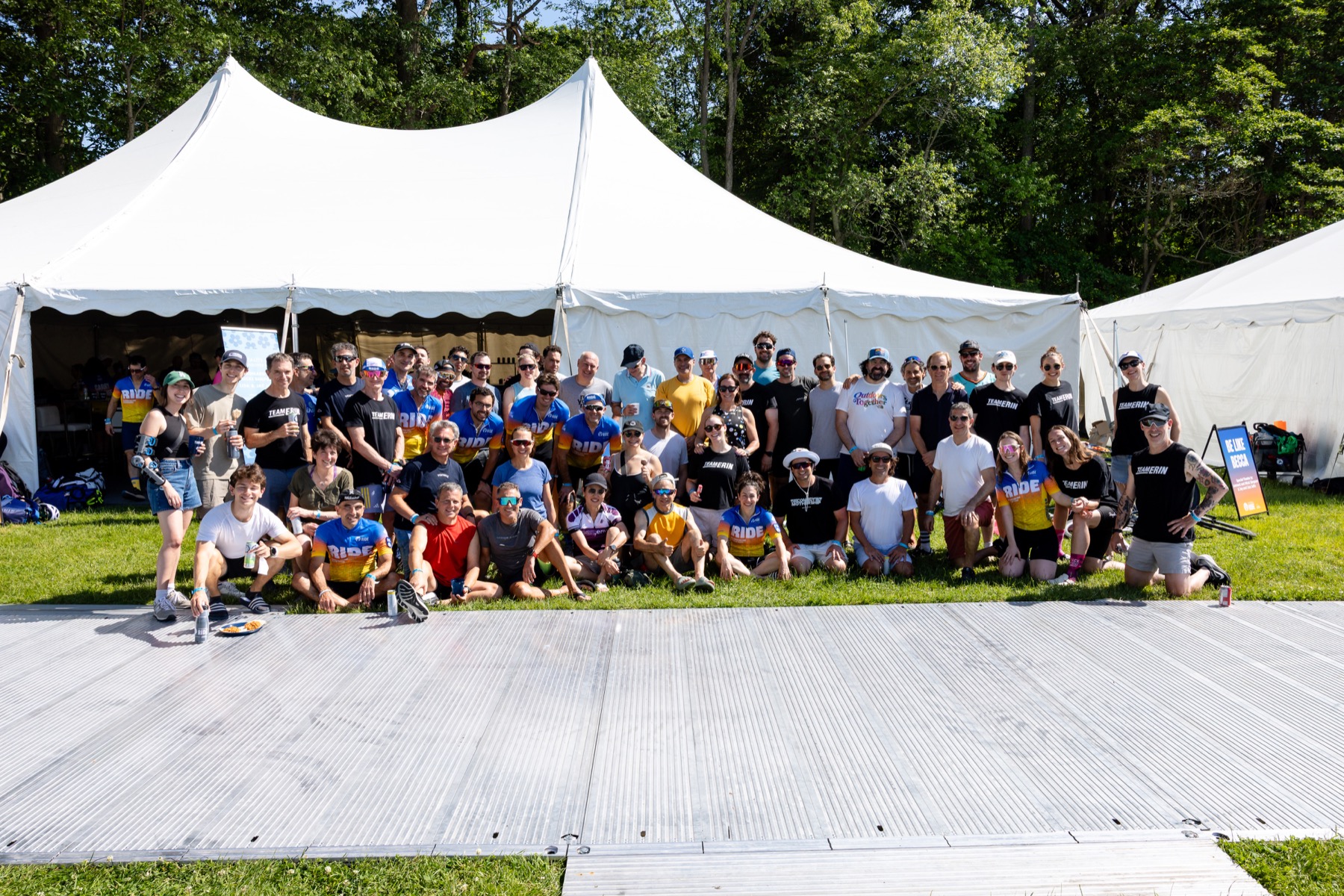 The Team Erin community gathered together outside their tent at the 2026 Ride